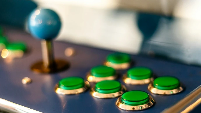a close up of a game board with green buttons